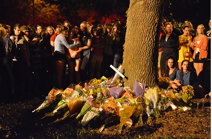 Hundreds of students gathered for a candlelight vigil at the accident site starting at 8 p.m. Sunday.