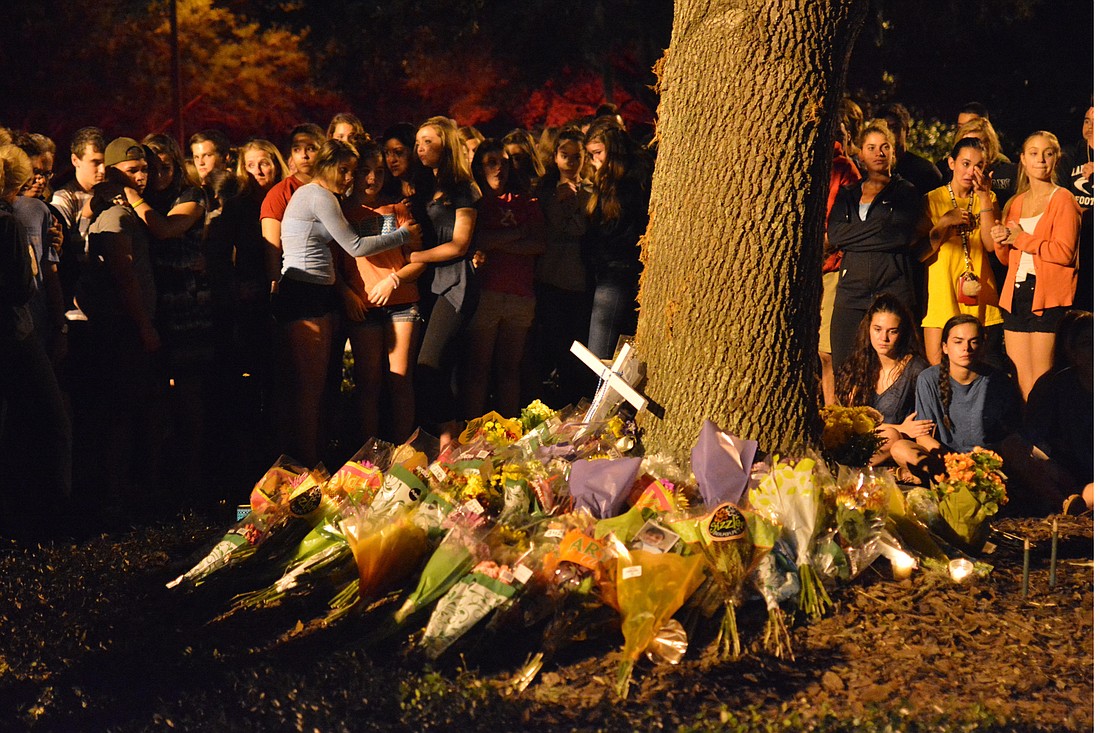 Hundreds of students gathered for a candlelight vigil at the accident site starting at 8 p.m. Sunday.