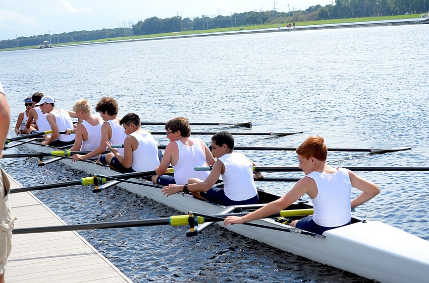 Sarasota rowers under 15 cruise up to the dock.