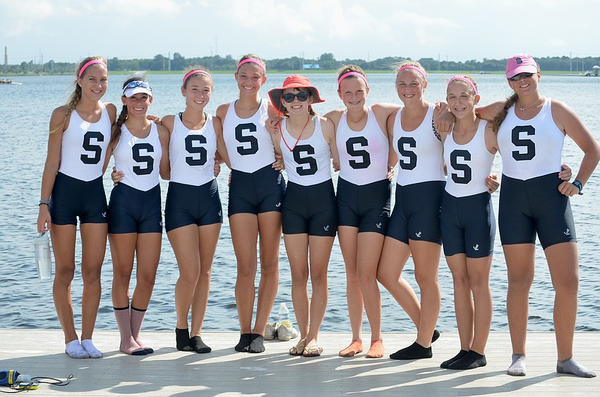 Before diving into the water, Sarasota under 15 crew members say cheese.