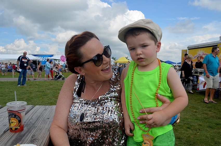 The event isn't just for adults. Sarah Goodwin and her son, Crew, enjoy the live music.