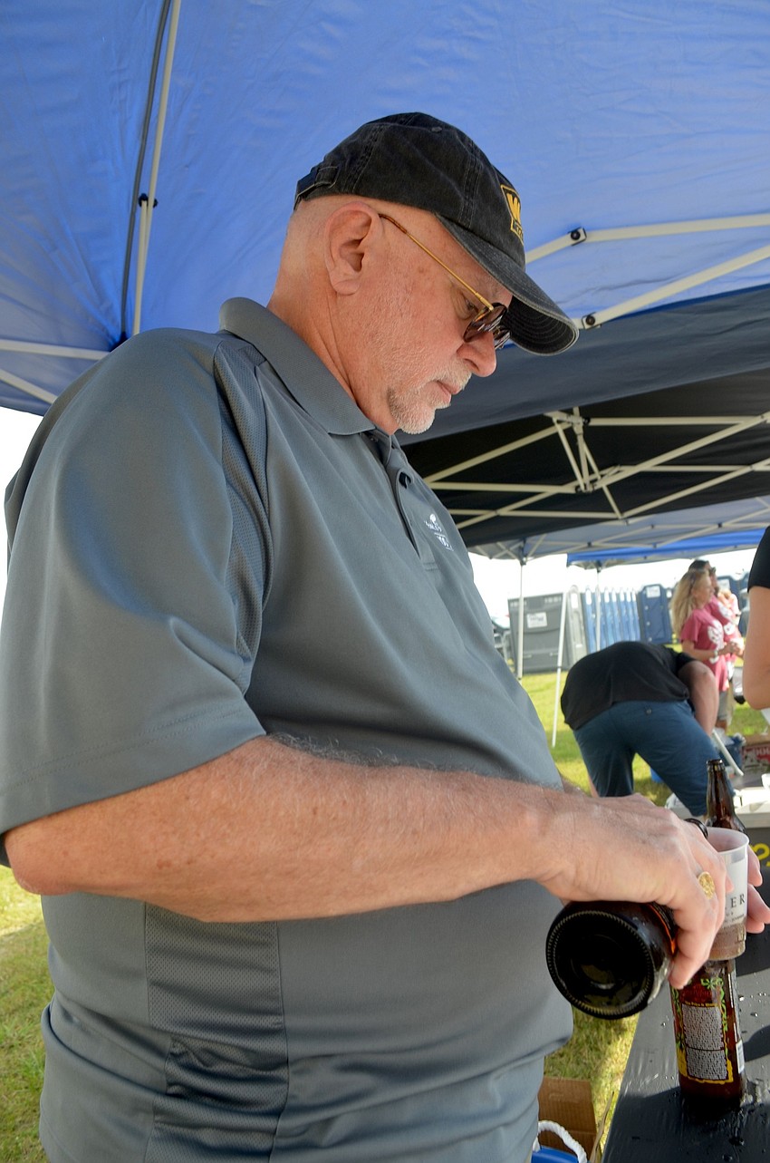 Rick Harris serves up cold brew for patrons.