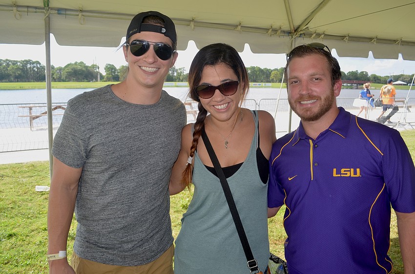 Vinny Corona, Chelsea Pridgen and Jared Guilliot find a spot in the shade.