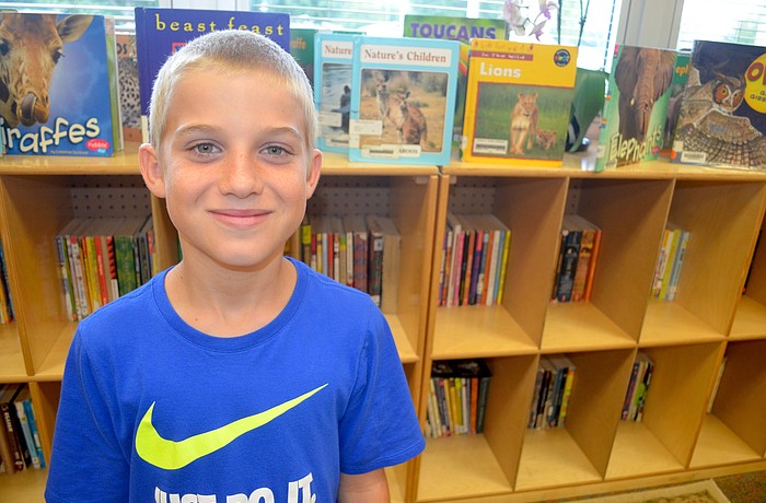 Nolan Mirikitani, a fourth-grader at Gilbert W. McNeal, has a passion for astronomy and studying what's happening in the sky. He hopes to visit the weather station soon.
