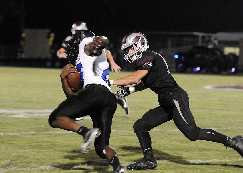 Rams safety Chris Mercendetti attempts to wrap up a Hillsborough Riverview running back.