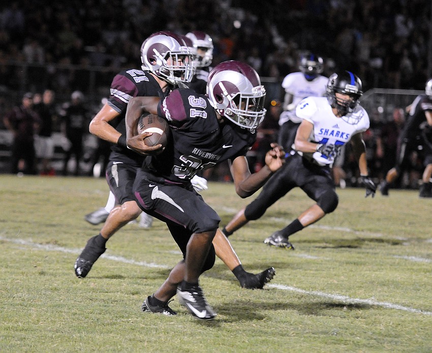 Senior Trequan Washington returns a punt in the first half.