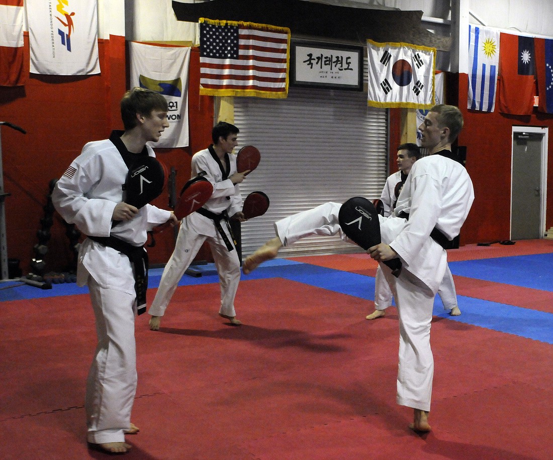 Travis Brazil and Isaac Weintraub train together six days a week at Red Tiger Martial Arts in Sarasota.