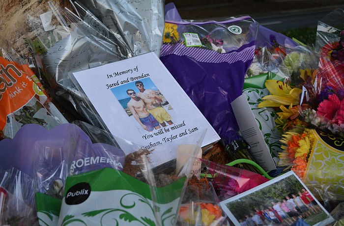 Friends and family have placed flowers, photographs and other items at the accident site.