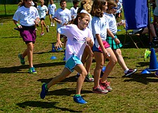 Ten-year-old Sydney Sprague leads a lap around the field.