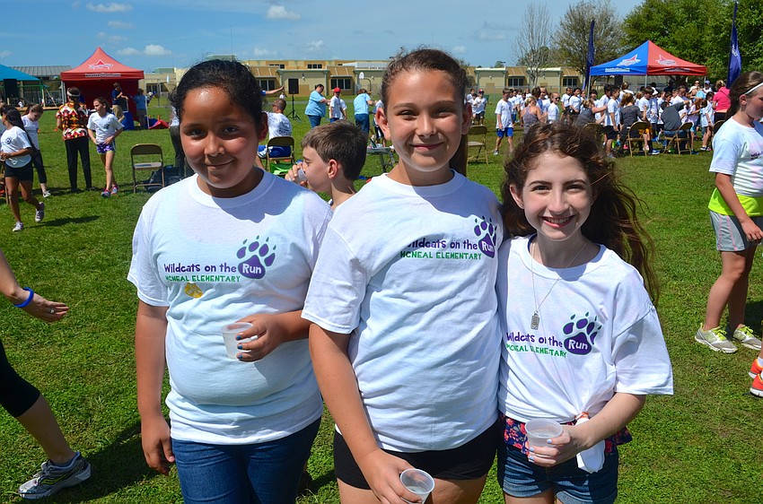 Krystal Ortiz, Carly Fults and Isabella Heupel find a spot at the water booth.