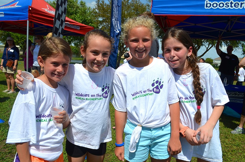 Jenna Wheeler, Morgan McCabe, Elli Baumhover and Alanna Fraser jog stick together during the informal race.