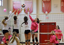 Sarasota Christian's Cheyenne Miller sends the ball back over the net in the first set.