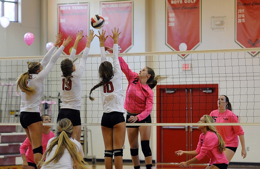 Sarasota Christian's Cheyenne Miller sends the ball back over the net in the first set.
