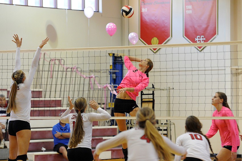 Sarasota Christian's Kelsey Miller sends the ball back over the net in the first set.