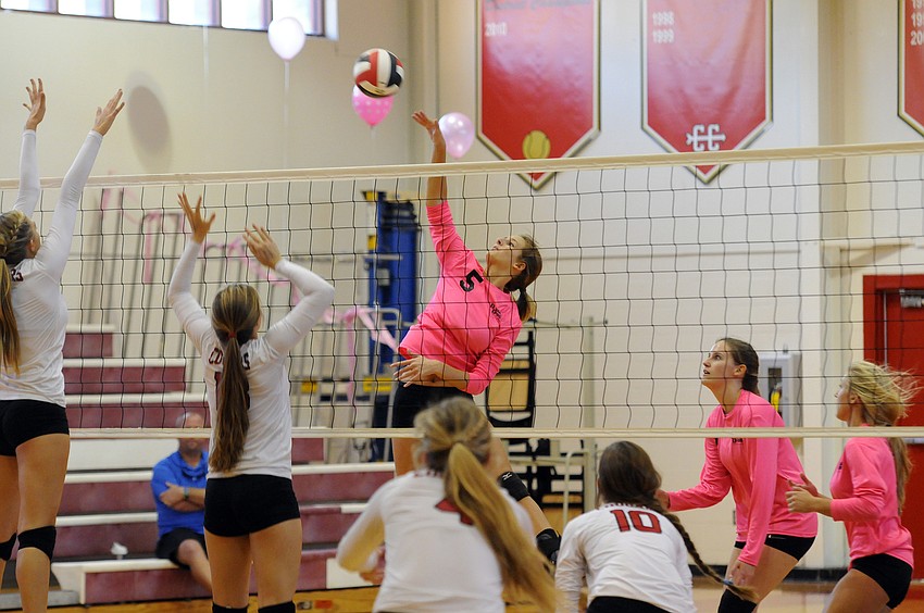 Sarasota Christian's Kelsey Miller sends the ball back over the net in the first set.