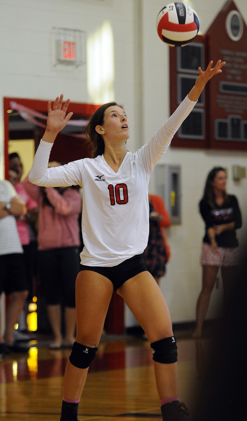 Sophia Hebda serves the ball for Cardinal Mooney in the first set.