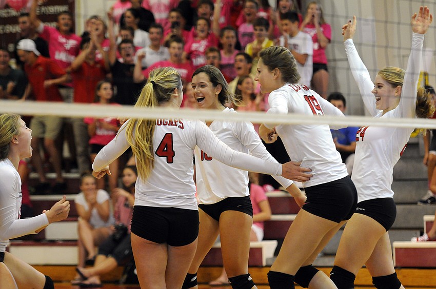 The Cardinal Mooney volleyball team celebrates a point during its match with Sarasota Christian Oct. 13.
