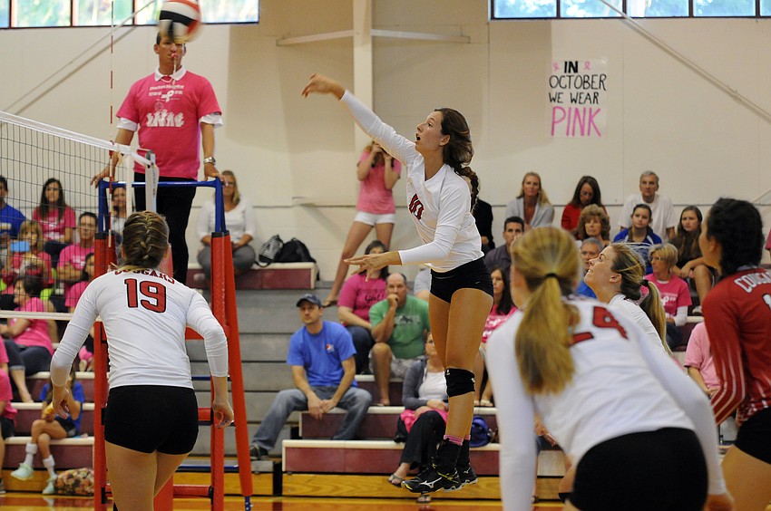 Cardinal Mooney's Sophia Hebda sends the ball back over the net in the second set.