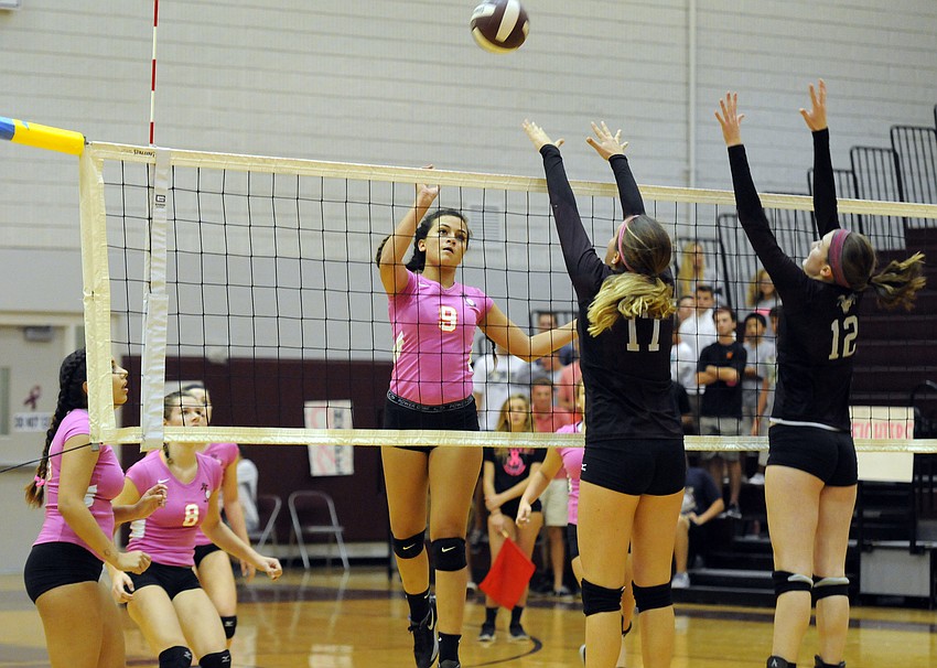 Sarasota middle hitter Emily Sauceda sends the ball back over the net in the first set.