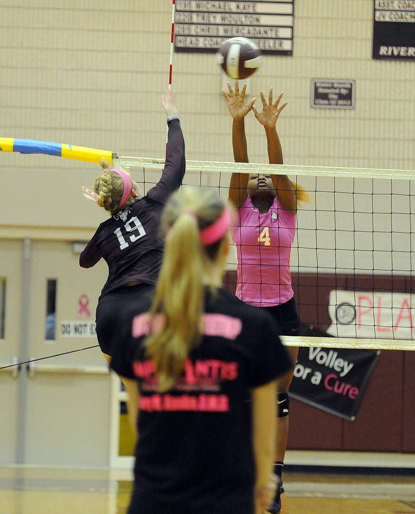 Sarasota sophomore Imani Jones goes up for a block in the first set.