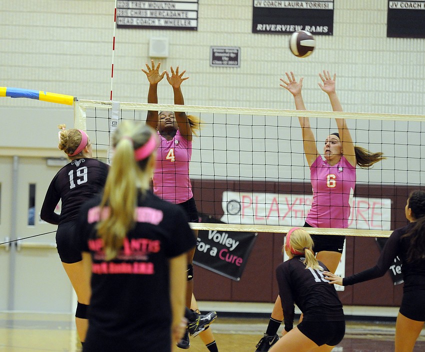 Sarasota's Imani Jones and Anna Massey go up for a block.