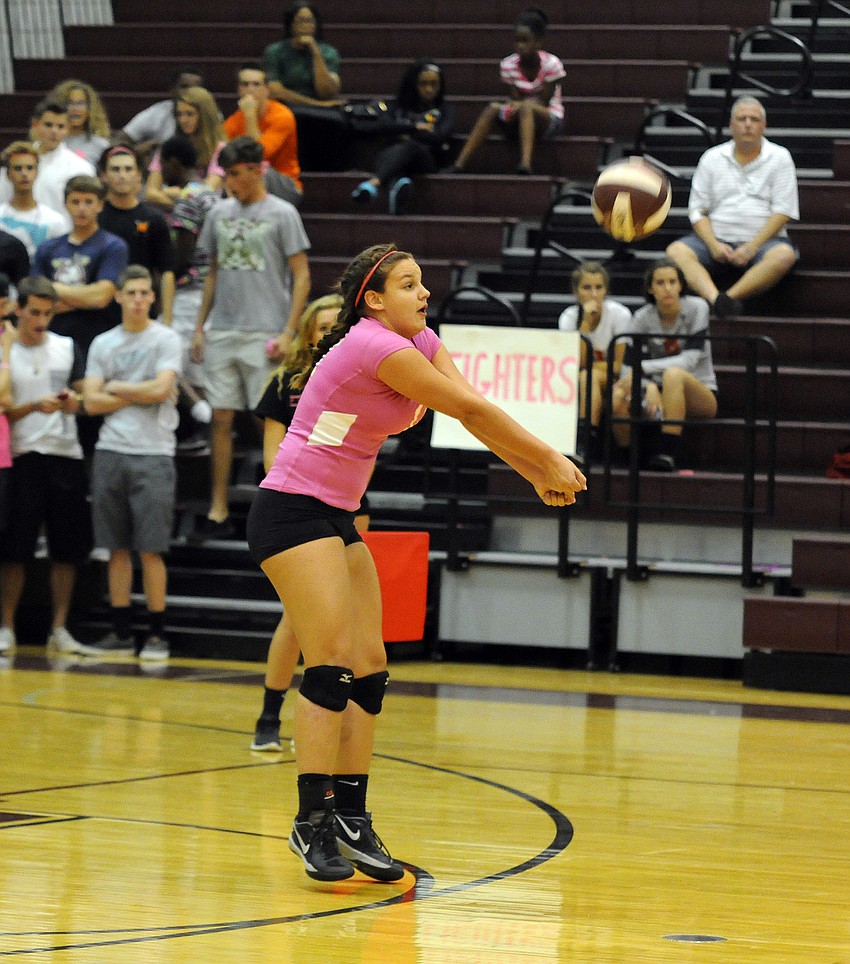 Sarasota sophomore Hannah Shiffner passes the ball back up to the front row.