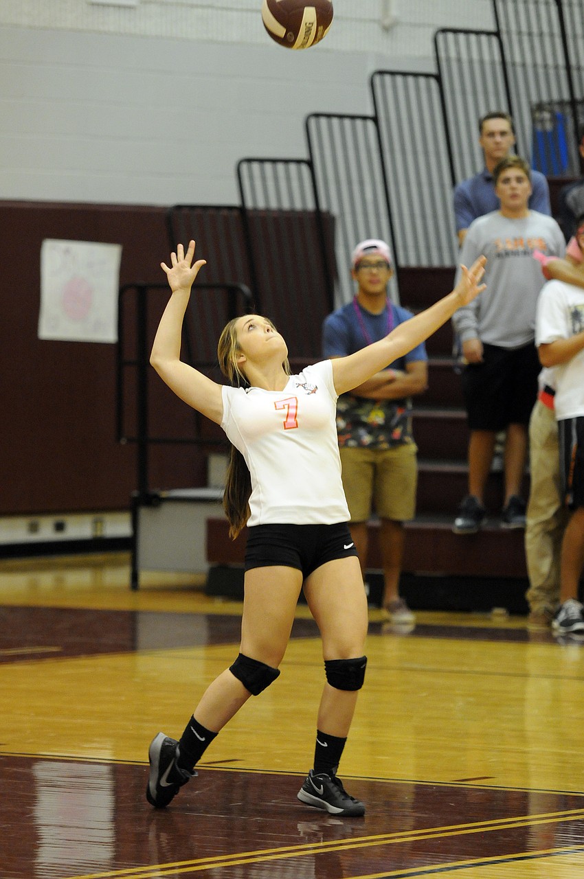 Sarasota libero Angela Hickerson serves the ball for the Lady Sailors.