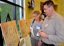 Suzanne and Don Gangnagel review the 10-year master plan for Community Haven.