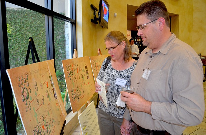 Suzanne and Don Gangnagel review the 10-year master plan for Community Haven.