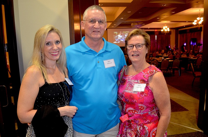 Hilary Dombroski poses with Rick and Kelly Askerud.