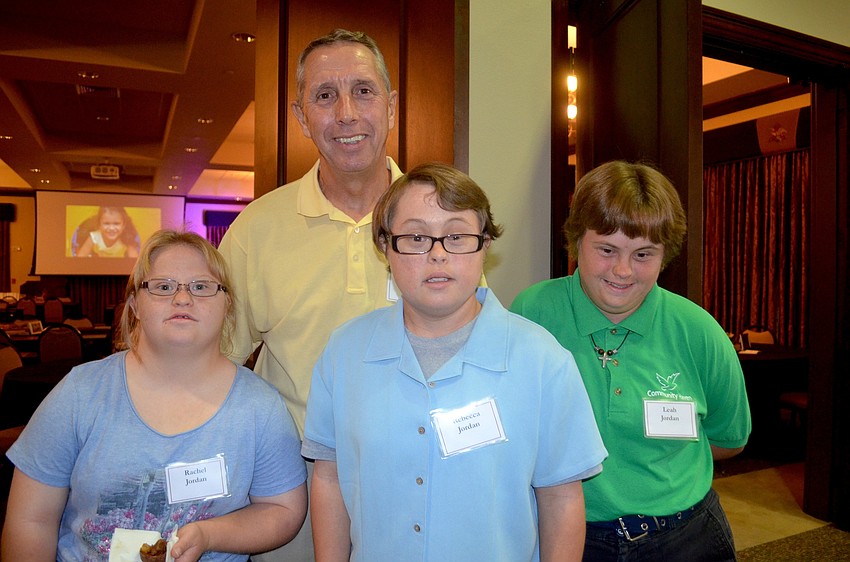 Mark Jordan (back center) enjoys a night out with his daughters, Rachel, Rebecca and Leah.