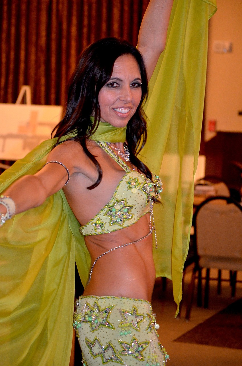 Local dance instructor Michelle Mercier performs a belly dance routine.