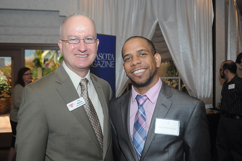 Tom Melville, executive director, and Denis Rodriguez, one of the program's adult learners