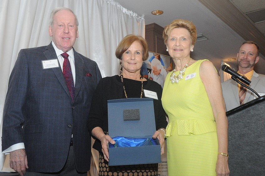 James Duffy and Carol Darling with Jolley Siegwald, center, who received the volunteer of the year award.