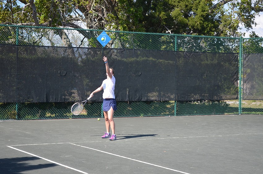 Dana Kamyshev, 17, serves.