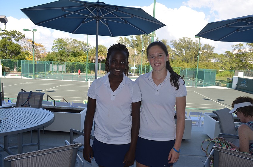 Players Jennifer Ibeto, 12, and Dana Kamyshev, 17