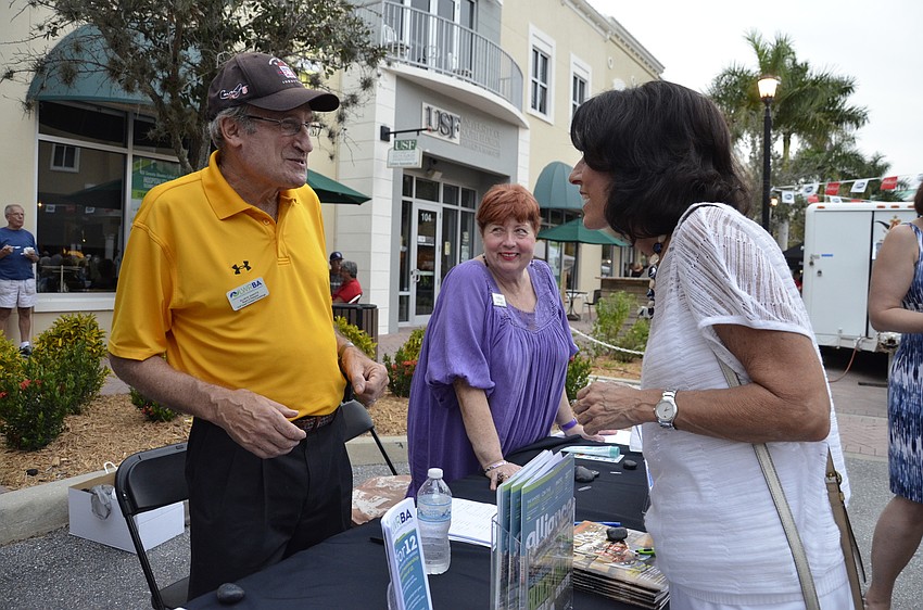 Allan Shaivitz and Janet Arena chat with Christine Mazur at the Lakewood Ranch Business Alliance booth.