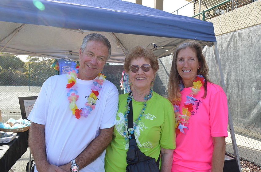 President Tim Thurman, volunteer Jackie Williams and Vice President Cyndi Seamon