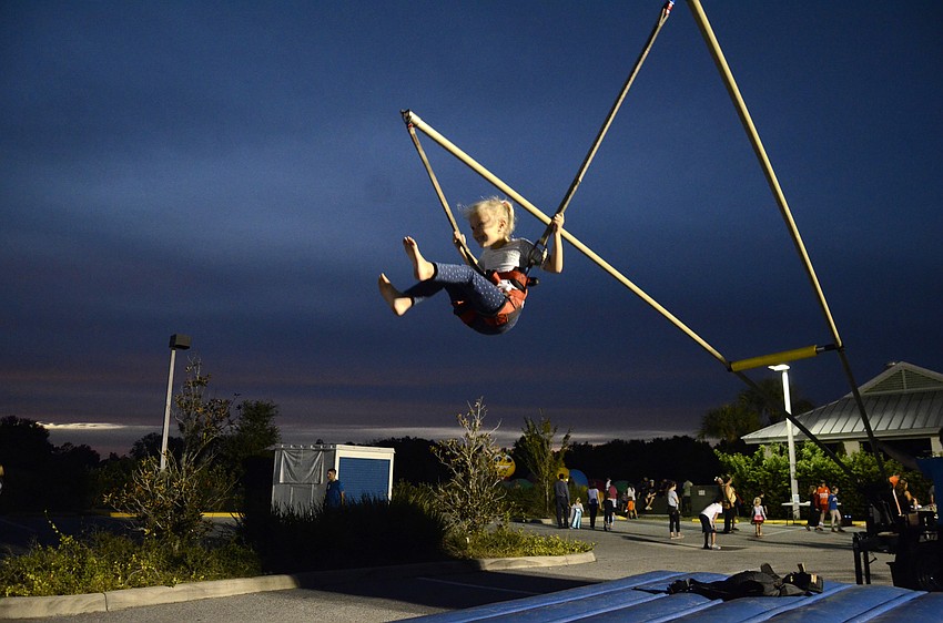 Olivia Drobny bounces on the bungee cord.