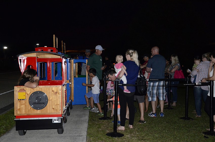 Kids load onto the train.