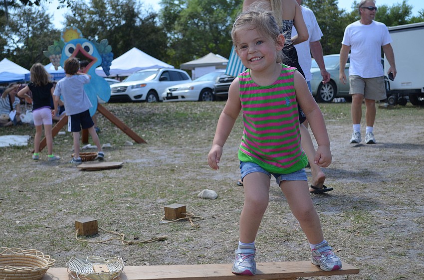 Emma Granthon enjoys the activities at Children’s Day at Phillippi Farmhouse Market.