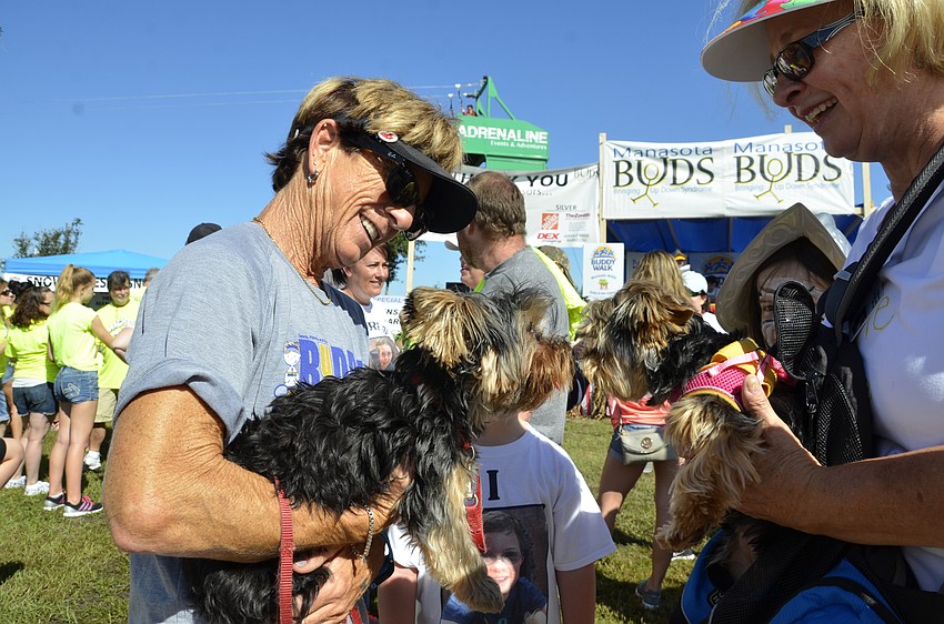 Sarasota resident JP Bellisimo, left, and Port Charlotte reisdent Nancy Collette, right, let their pups Gatsby and Daisy get acquainted.