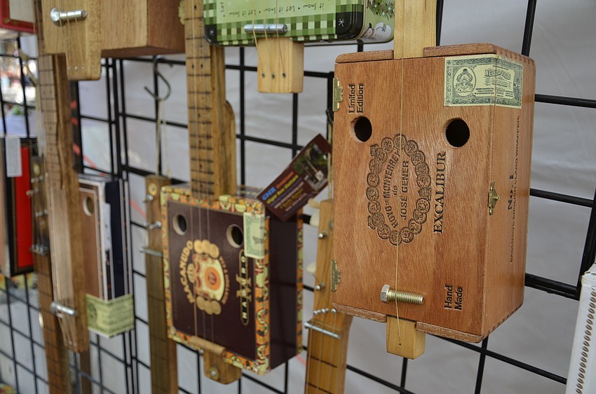 Cigar Box Guitars out of North Port displayed its handmade instruments at the craft market.