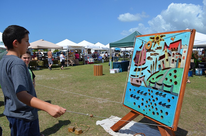 Emma Granthon enjoys the activities at Children’s Day at Phillippi Farmhouse Market.