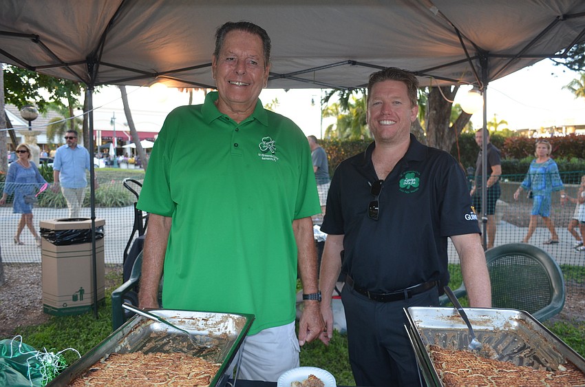 Jim Schwartz and owner and 50/50 raffle winner Jason Burns, of Lynches Pub & Grub