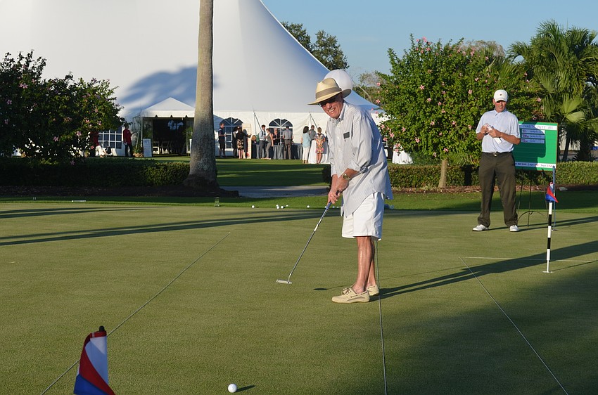 Mayor Jack Duncan participates in a putt-off to raise money for the town’s 60th anniversary party.