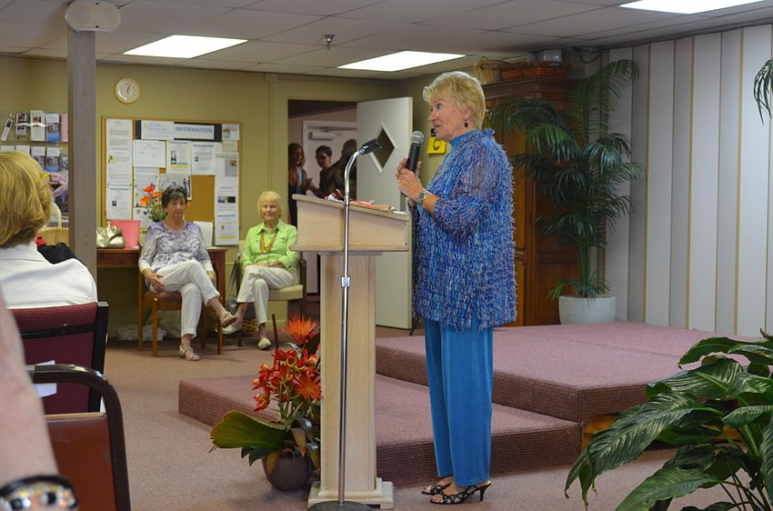 Sue Reese introduces the models.