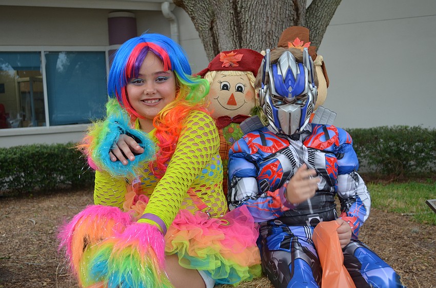 Joli Zaki and Cayden Hill dressed as a rainbow and Optimus Prime, respectively.