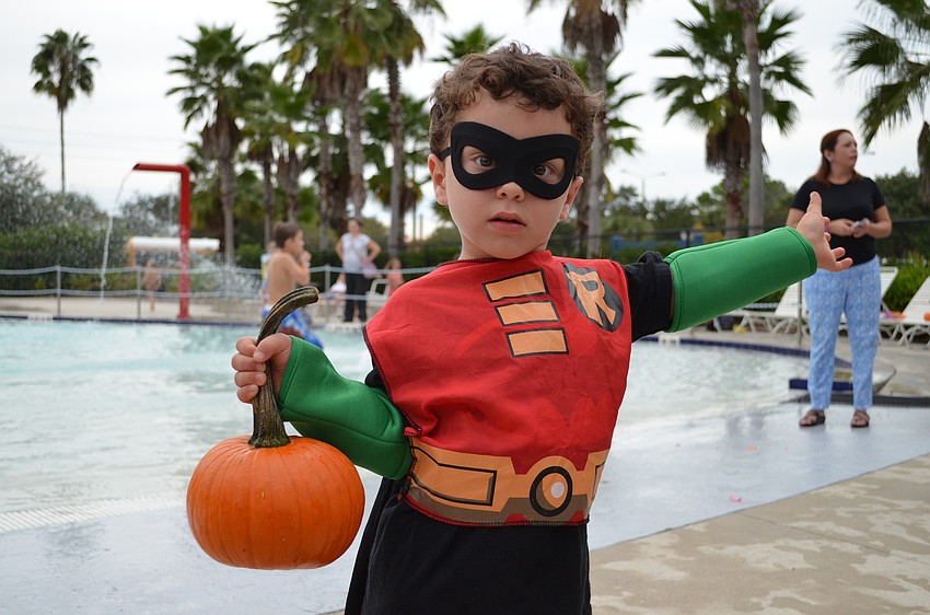 Chuckie Defazio aka Robin shows off the pumpkin he was able to retrieve from the floating pumpkin patch.