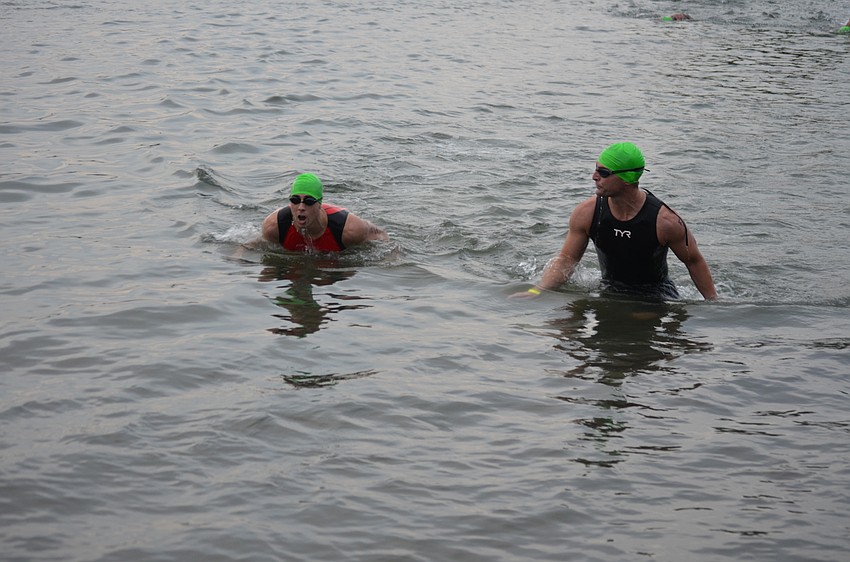 Male swimmers end their first of two laps.